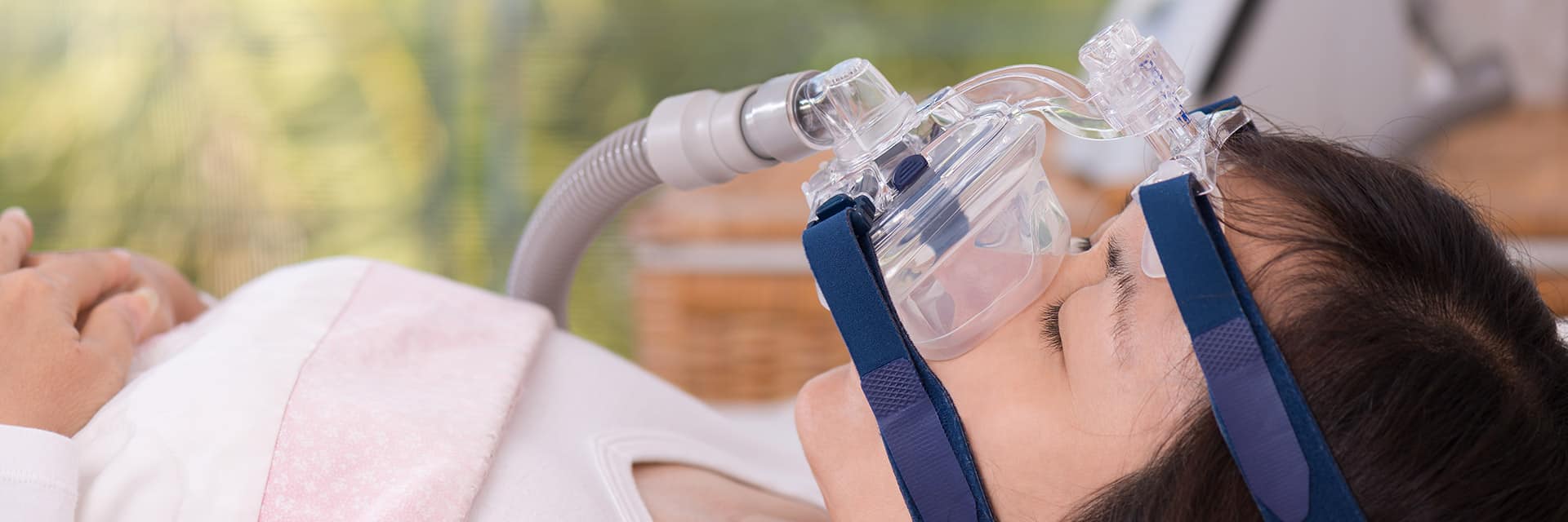 sleep apnea patient sleeping with cpap mask over face