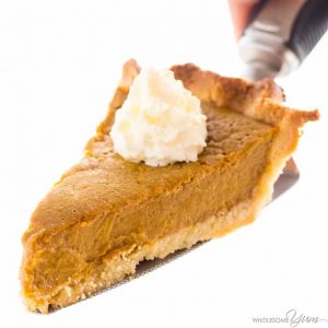 photo of pumpkin pie with whip cream slice