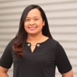 kim morris profile image of her smiling in a black shirt