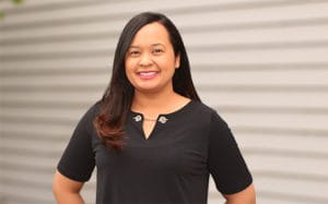 kim morris profile image of her smiling in a black shirt