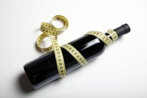 wine with measuring tape wrapped around it